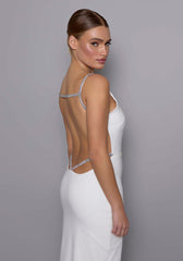 Close-up side back view of the VSPR Alba dress showcasing the shimmering silver crystal straps and the open-back detail framed against the smooth ivory fabric.